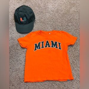 Garb Orange and Green University of Miami Kids Tee and Legacy Ball Cap.